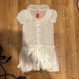 Sheer white Peter Pan collar blouse with ribbon and pearl button closures